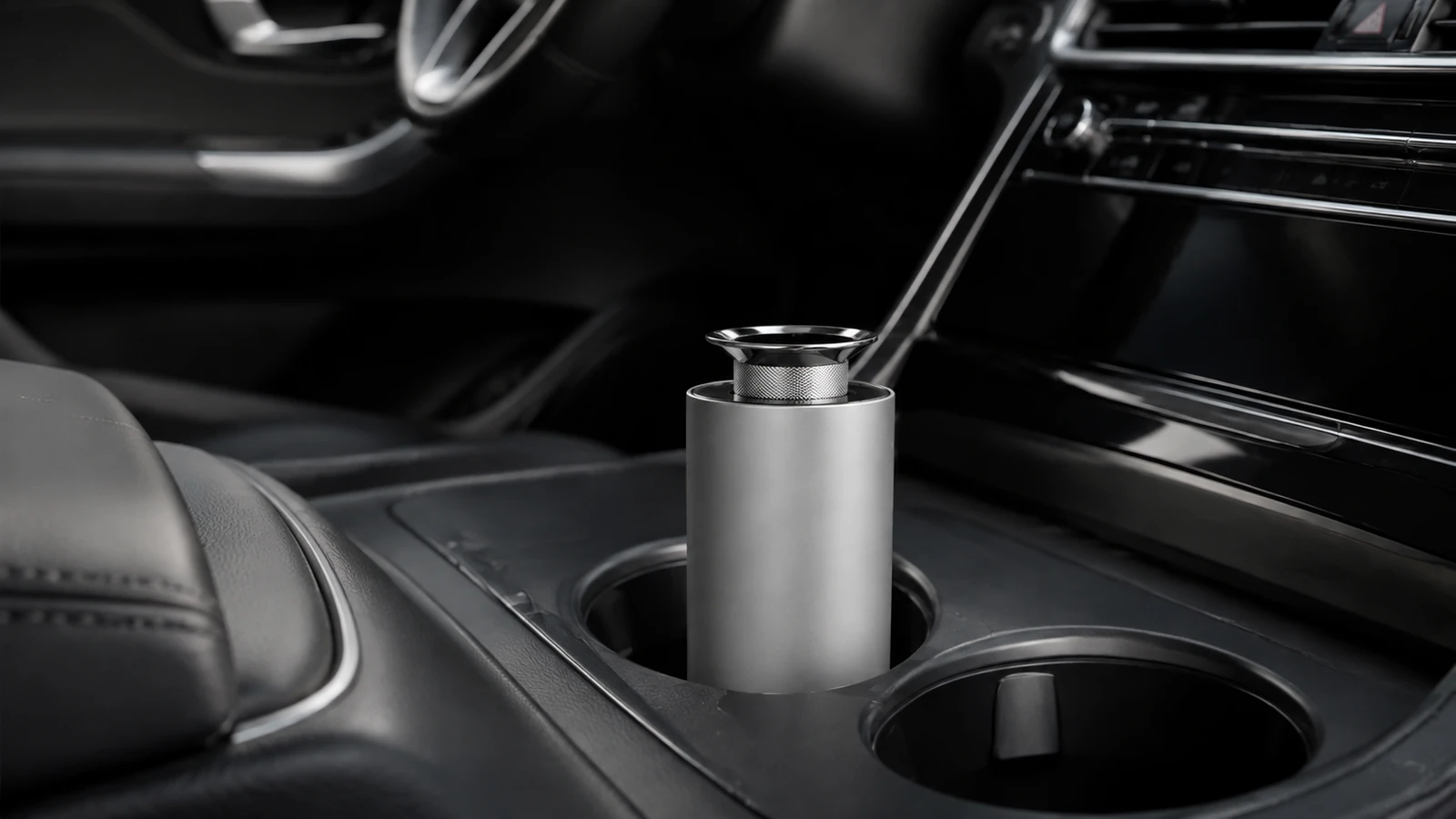 Silver CarPro diffuser installed in a vehicle cupholder